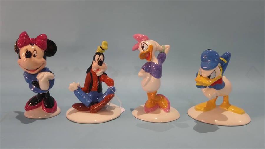 Four Royal Doulton 'Mickey Mouse Collection' figures.