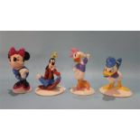 Four Royal Doulton 'Mickey Mouse Collection' figures.