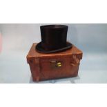 A Tress and Co top hat, in fitted leather case. Hat size 6.5cm x 20.5cm