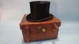A Tress and Co top hat, in fitted leather case. Hat size 6.5cm x 20.5cm