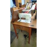 Modern Singer sewing machine and table