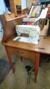 Modern Singer sewing machine and table
