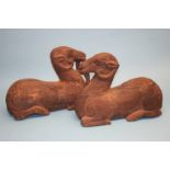 A pair of large Oriental carved wood figures of rams. 36.5 cm high