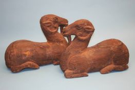 A pair of large Oriental carved wood figures of rams. 36.5 cm high