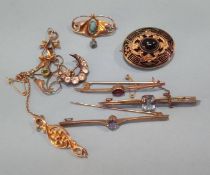 A collection of various gold brooches etc.