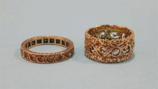 Two unmarked gold coloured rings
