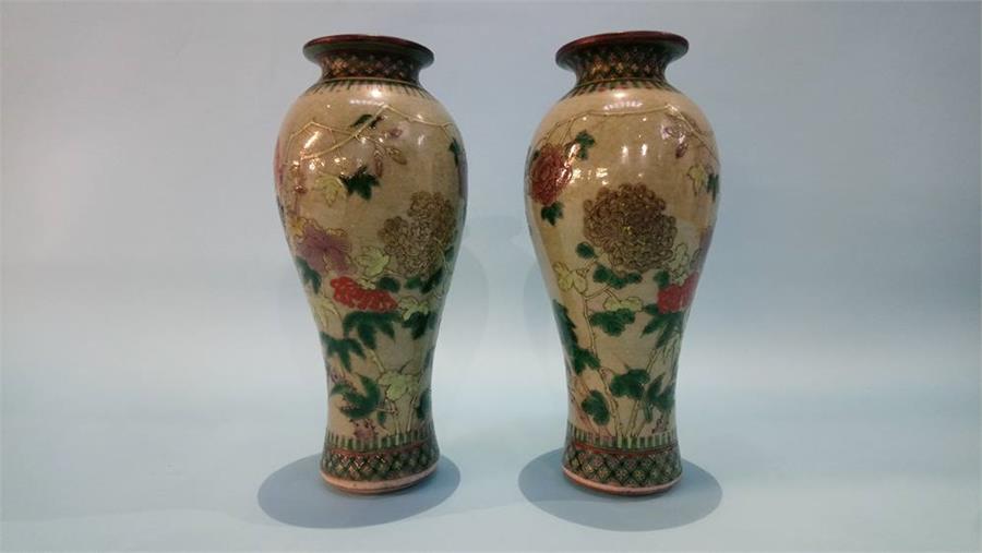 Pair of drab green Chinese vases, decorated with flora, 26cm