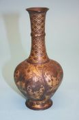 A parcel gilt bronze lobed vase, decorated with peacocks, marks to base. 17 cm high
