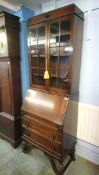 An oak bureau bookcase