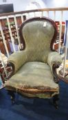 A Victorian mahogany spoon back armchair