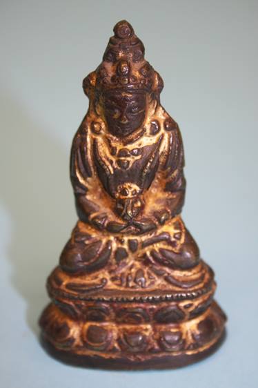 A small gilt bronze Chinese Deity. 8 cm high
