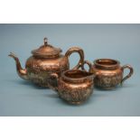 A Chinese silver three piece tea set, stamped 90, weight 1215.7 grams/39 oz