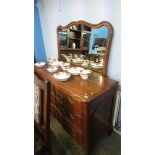 A large American chest with nine drawers and an over mirror