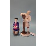 Two Royal Doulton figures Boy from Williamsburg' and 'Wigmaker of Williamsburg'