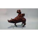 A bronze Oriental figure group of a gentleman riding a water buffalo