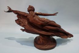 An Art Deco style bronze of a Lady with arms outstretched riding on a cloud.
