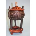 A Chinese carved hardwood bronze censor, fitted stand and lid with jade finial. 28 cm high