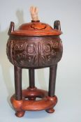 A Chinese carved hardwood bronze censor, fitted stand and lid with jade finial. 28 cm high