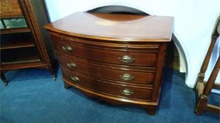 A good pair of mahogany bow front chest of drawers with brushing slide below three long drawers,