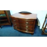 A good pair of mahogany bow front chest of drawers with brushing slide below three long drawers,