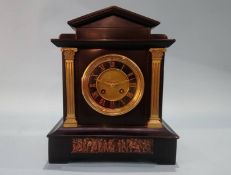 A Victorian slate mantel clock.