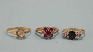 Two 9ct gold dress rings and one other