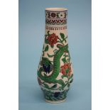 A slender Chinese porcelain vase, decorated with dragons amongst foliage (with glass plates). 20.5