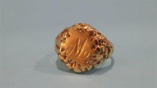 An unmarked gold coloured gents signet ring