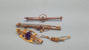 Three gold coloured brooches