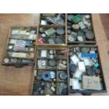 Five various trays of assorted watch parts etc.