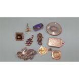 A collection of various silver brooches and fobs etc.