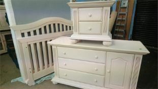 An American 3/4 bed and a pale pink chest of drawers and bedside drawers
