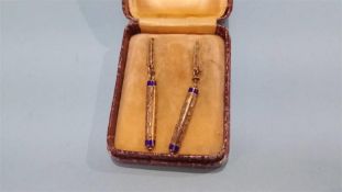 Pair of earrings in the form of prayer scrolls, stamped 585, 3.3 grams