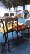 An Oriental hardwood two tier side table, 83cm wide