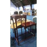 An Oriental hardwood two tier side table, 83cm wide