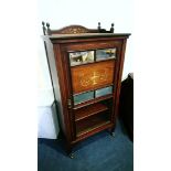 An Edwardian mahogany and inlaid cabinet