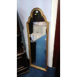 Gilt framed mirror with arched top