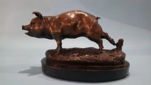 A bronze model of a Pig.