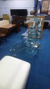 Three glass tables, an uplighter and leather foot stool