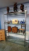 A set of metalwork and glass shelves