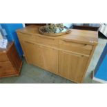 A pale oak small sideboard