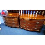 A pair of mahogany bow front chest of drawers, with brushing slides, above three long drawers