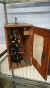 Microscope in fitted mahogany case