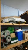 Quantity of camping equipment on two shelves