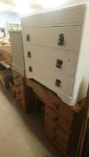 Metal headboard, pine dressing table, chests of drawers and a bedside cabinet