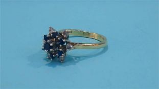 An 18ct diamond and sapphire ring