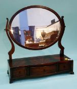 A mahogany serpentine fronted toilet mirror