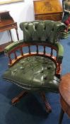 A green leather Chesterfield office chair