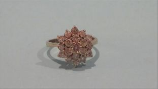 A diamond flower cluster ring
