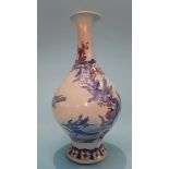 An Oriental vase with flared rim, decorated with birds resting on branches. 34cm high